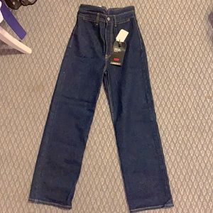 New, never been worn Levi jeans. High waisted rib cage, dark blue, straight leg.